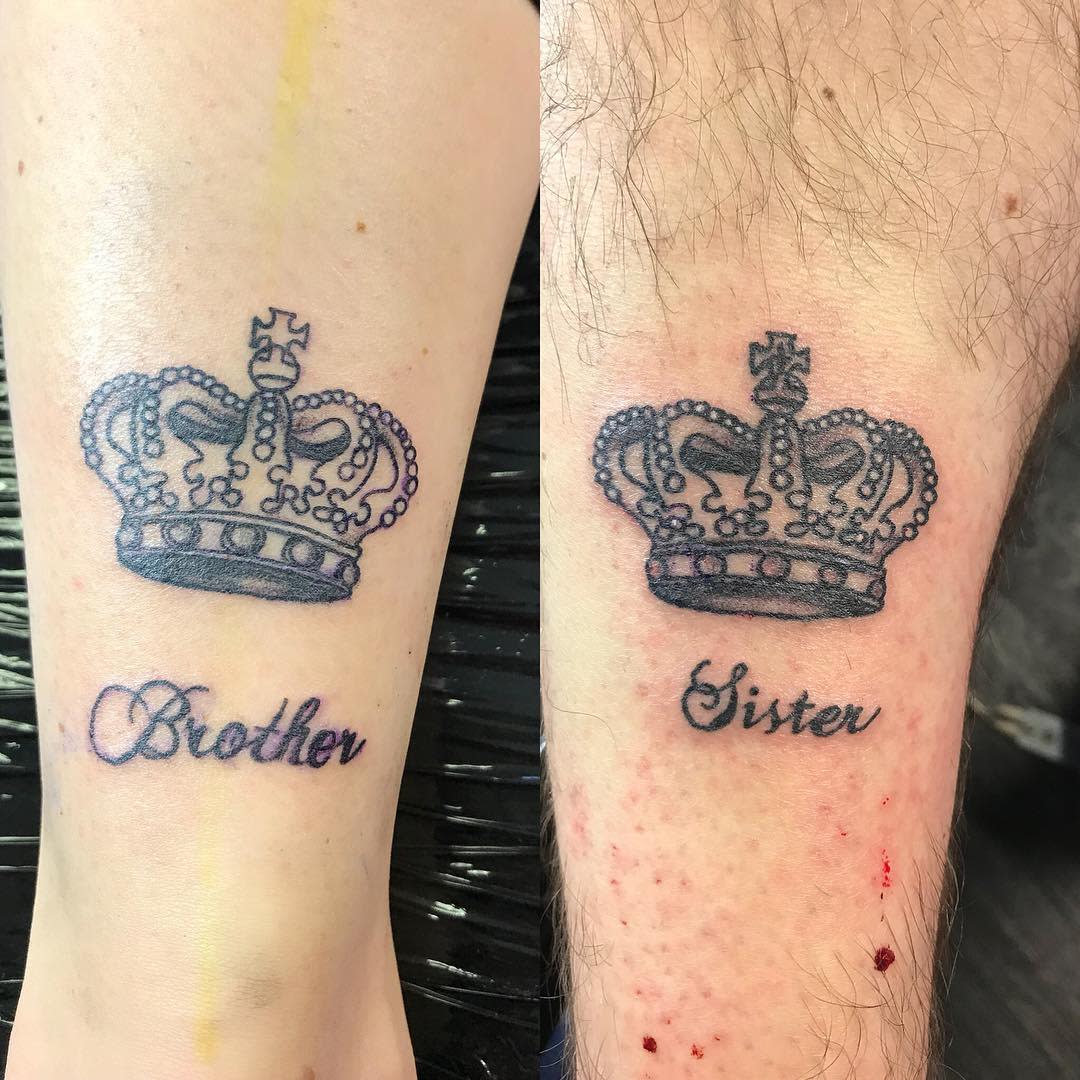 Tattoos of crowns with the words "Brother" and "Sister" on two different forearms